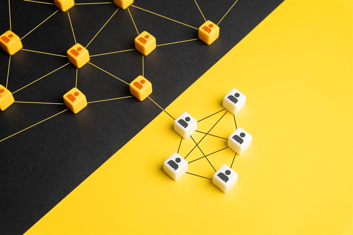 Two networks of connected blocks on black and yellow
